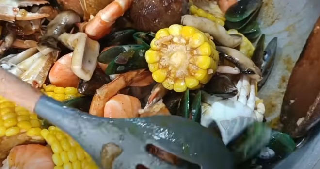 mixing all seafood in with corn